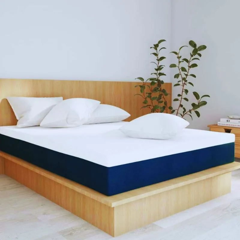 Colchão Guldi Original de molas ensacadas híbrido com visual bicolor azul e branco.